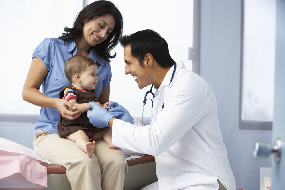 Mother with child consulting a pediatrician